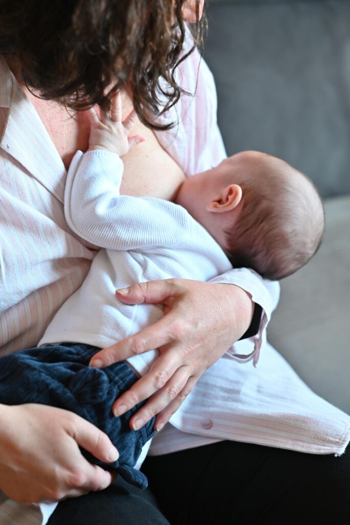 A woman breastfeeding her baby.