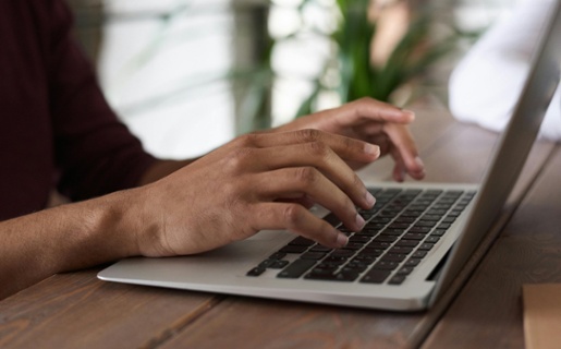 A person typing on a computer.